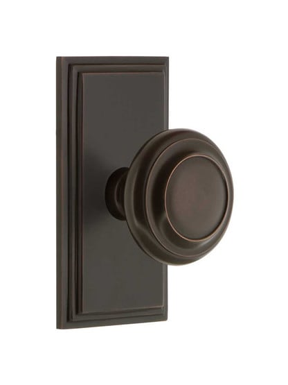 Grandeur Carre Rosette Door Set with Circulaire Knobs in Timeless Bronze.